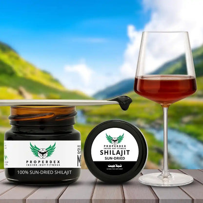 Properdex Shilajit resin open jar with lid, scoop and glass lifestyle photo